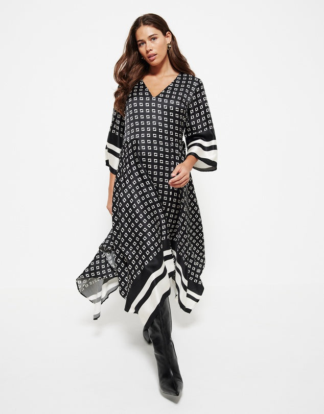 Stylish v-neck dress with 3/4 sleeves to pair with boots and a black blazer