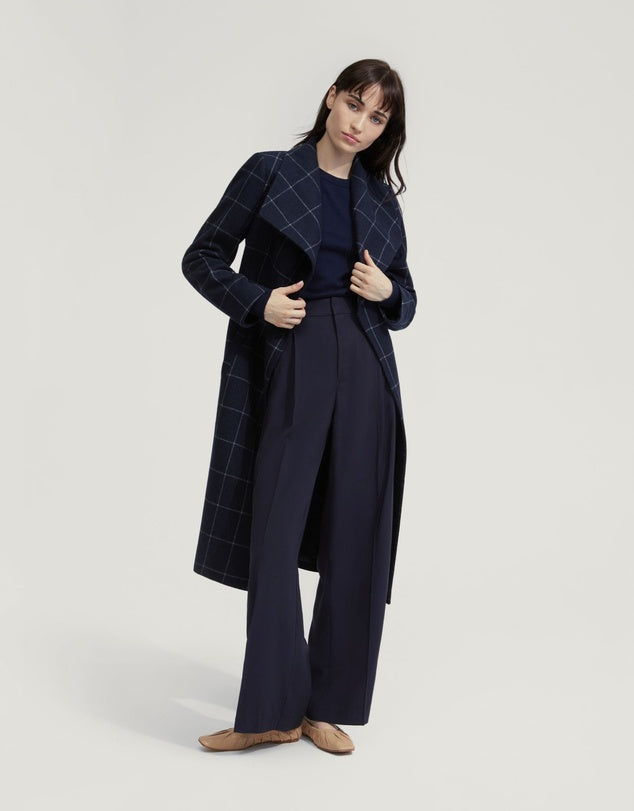 Belted navy wool coat with subtle check pattern