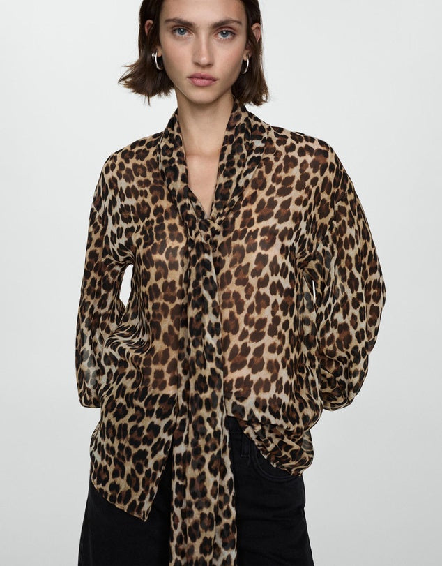 A fun and essential animal print blouse for all year round wear. Perfect with black bottoms, like pants or skirts and even great for dressing up jeans.