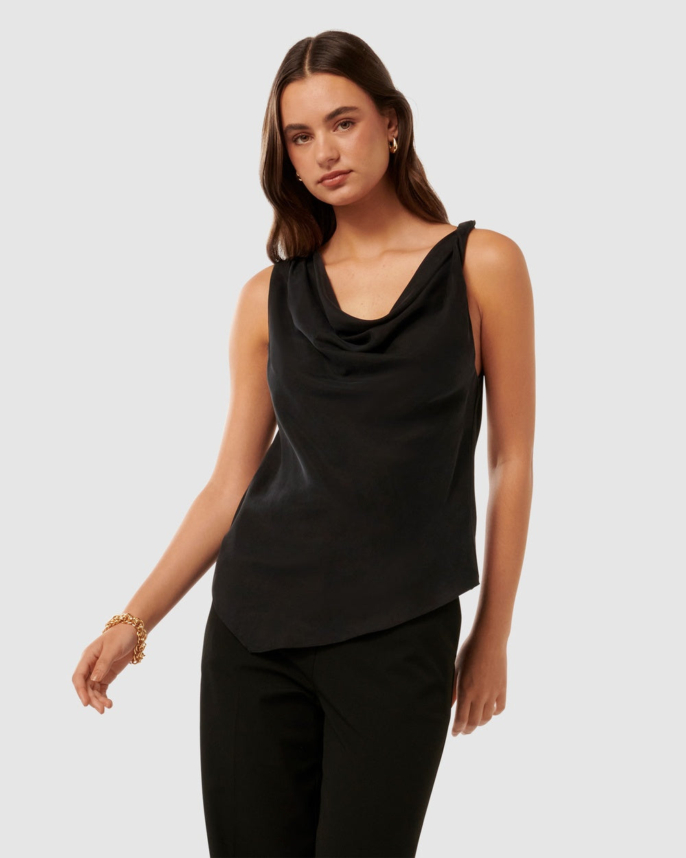 A classic cowl neckline asymmetrical hemline top in black to take you from day to night weekday to weekend