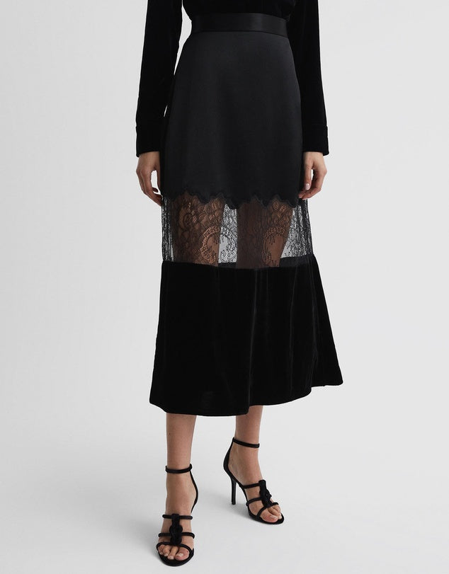 Victoria Beckham style skirt with mesh and lace detailing for pairing with blouse