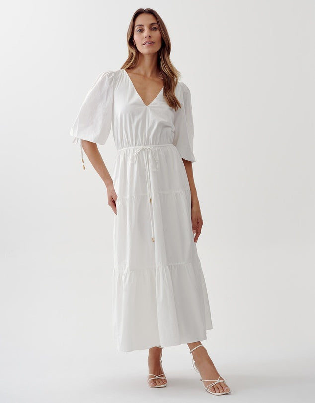 White cotton tiered midi dress. This is perfect for work and the weekend. Pair with a blazer for work, or a pair of sneakers for the weekend.